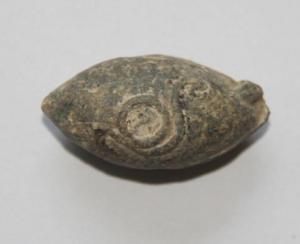 Sling_bullet_of_lead_with_a_drawing_Roman_period.jpeg